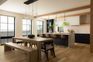 Smart kitchen in an Eldorado custom home featuring large windows, natural wood floors, exposed beams, and integrated smart lighting
