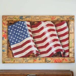 Our Lead Carpenter, Nelson, painted and built a wooden flag at all Homes For Our Troops Homes using 2x4's that the community wrote kind words on.