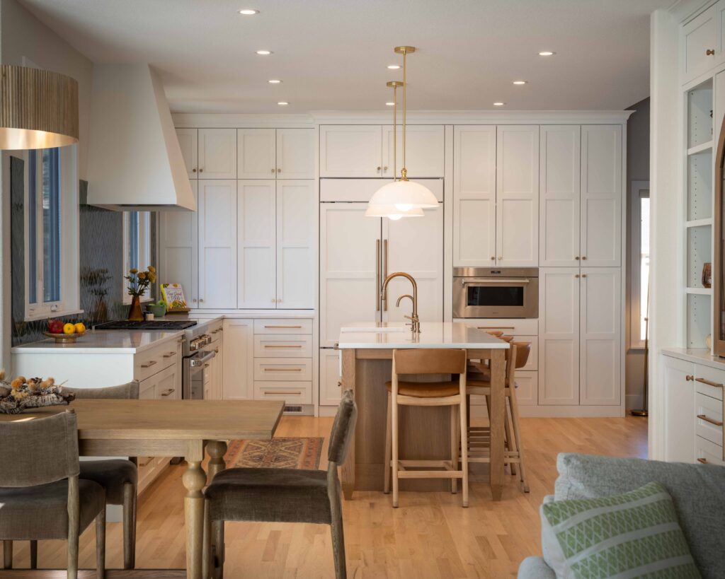 Island kitchen layout with central gathering space designed by Built By Krueger