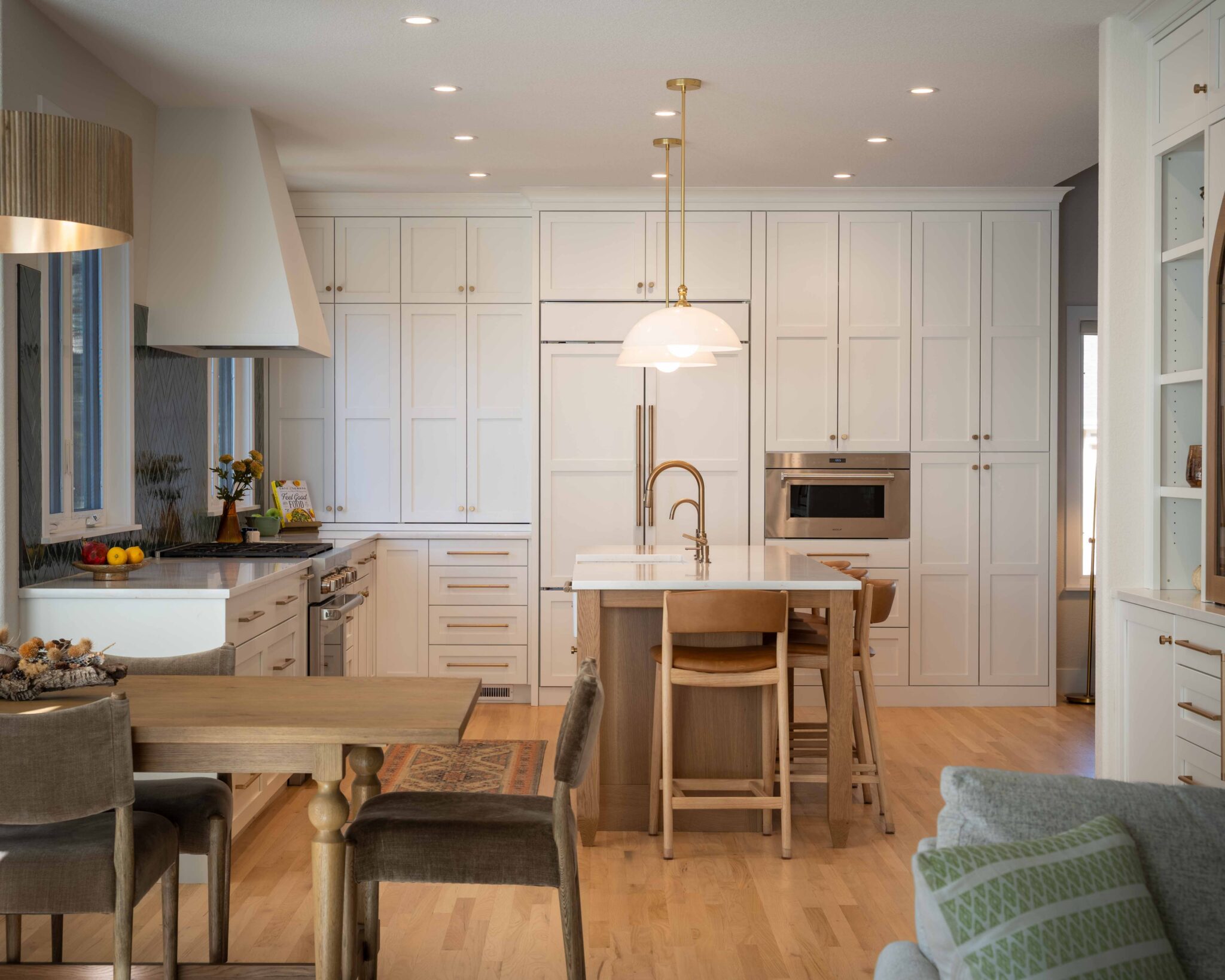 Island kitchen layout with central gathering space designed by Built By Krueger