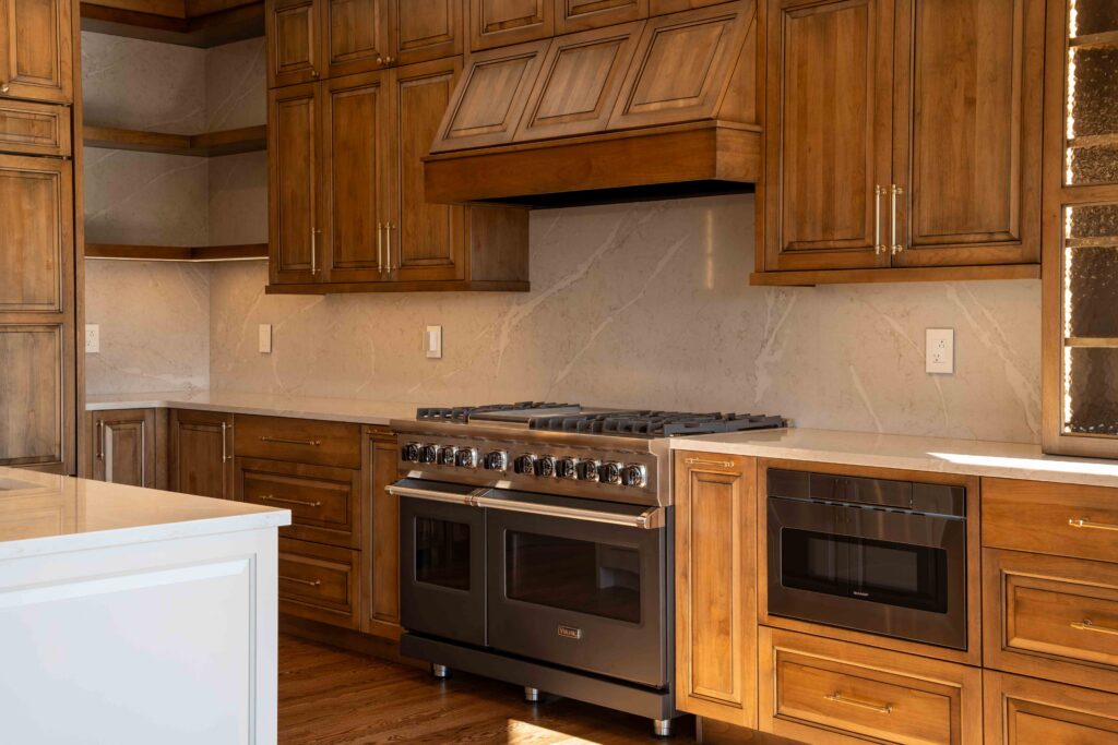 Open rustic kitchen with natural wood finishes and warm lighting